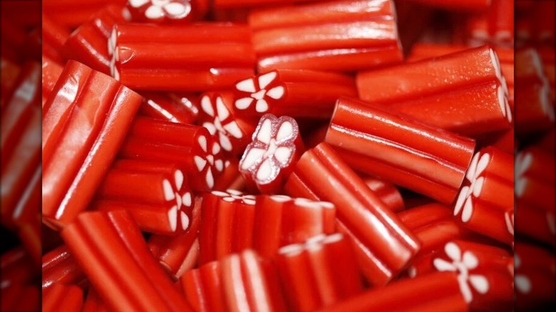 Pile of loose strawberry pistol licorice candies