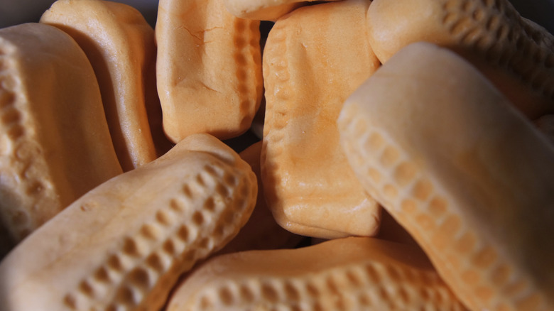 Loose pile of orange-colored marshmallow circus peanuts