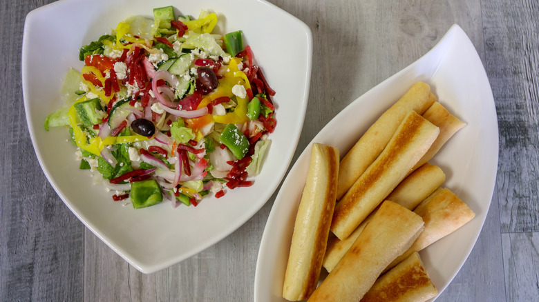 Salad and breadsticks