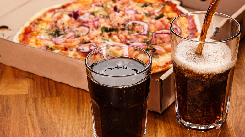 Pizza and glasses of soda