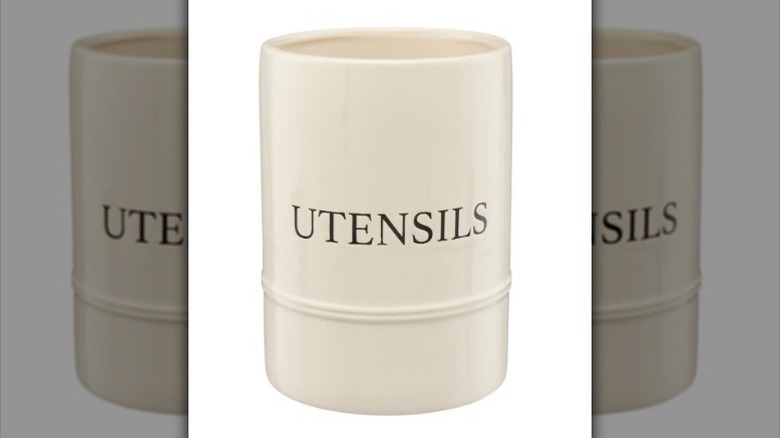 Utensils kitchen crock on white background