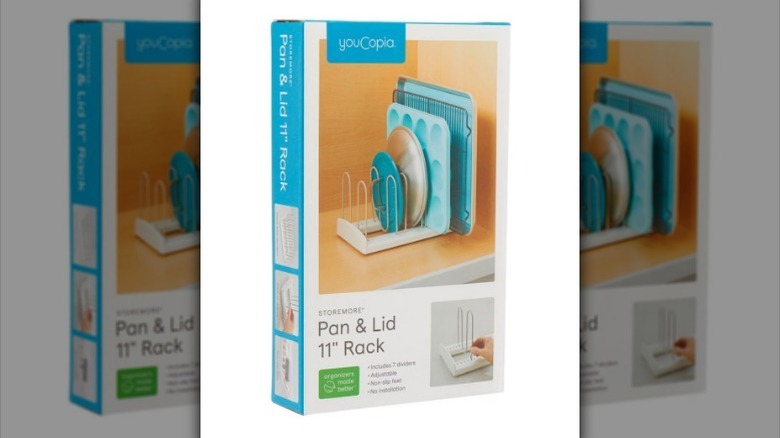 Pan and lid rack on white background