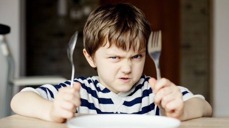 upset child waiting for food
