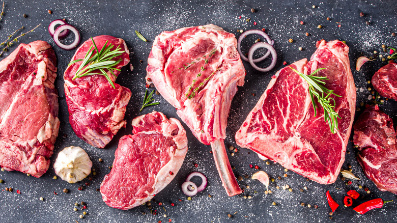 Cuts of steak on table