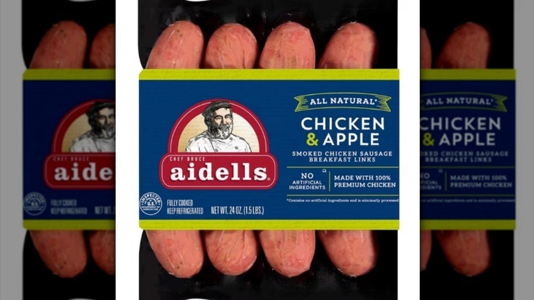 Chicken apple sausage with a blue label on white background