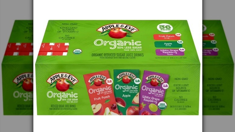 A green box of an Apple and Eve organic juice drink variety pack on white background