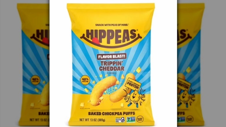 Hippeas chickpea puffs with a yellow and blue bag on white background