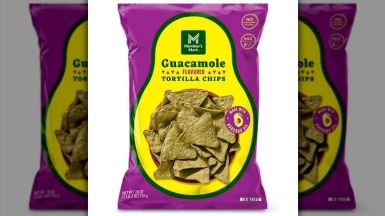 A purple and yellow-green bag of guacamole chips on white background