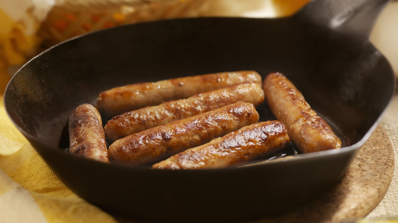 sausages in pan on table