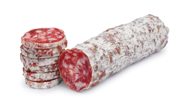 sliced salami on white background