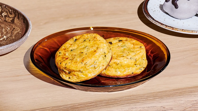 Close-up of Starbucks' Italian sausage egg bites on an orange glass plate