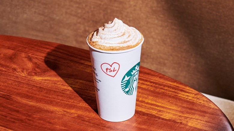 Starbucks' pumpkin spice latte on a table