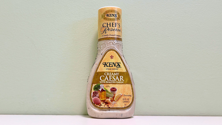 A bottle of Ken's Steak House Chef's Reserve Creamy Caesar Salad Dressing with Roasted Garlic