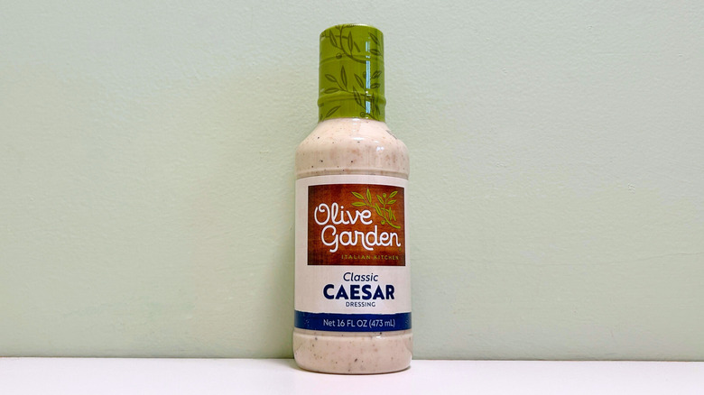 A bottle of Olive Garden Classic Caesar Salad Dressing