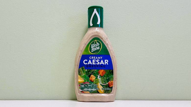 A bottle of Wish-Bone Creamy Caesar Salad Dressing