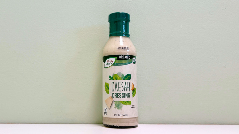 A bottle of Simply Nature Organic Caesar Salad Dressing