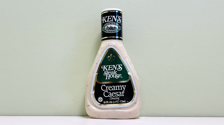 A bottle of Ken's Steak House Creamy Caesar Salad Dressing