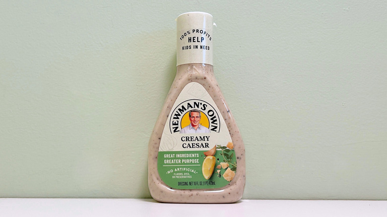 A bottle of Newman's Own Creamy Caesar Salad Dressing