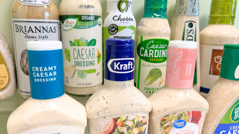Extreme close up of several bottles of Caesar dressing