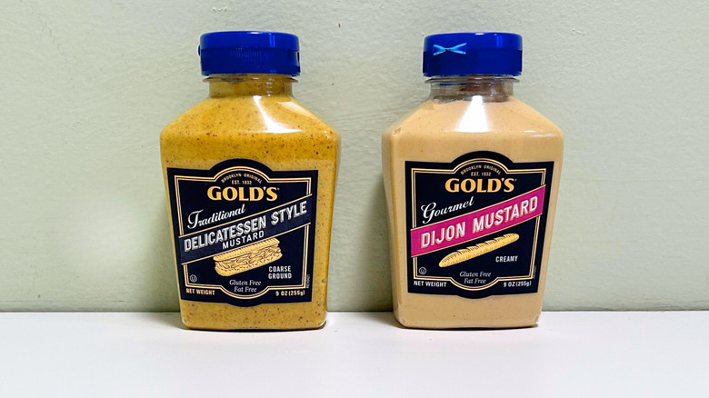Bottles of Gold's Traditional Delicatessen Style Mustard and Gold's Gourmet Dijon Mustard