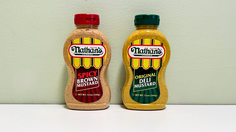 Bottles of Nathan's Famous Spicy Brown Mustard and Nathan's Famous Original Deli Mustard