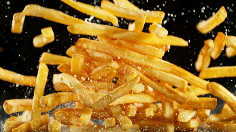 french fries flying with salt