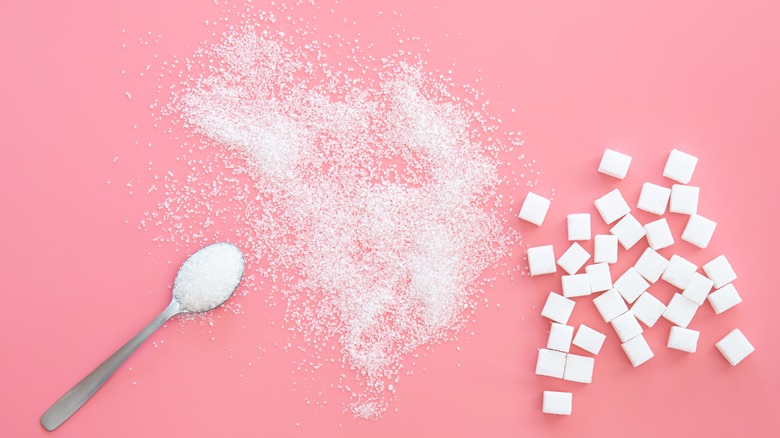 sugar in spoon and sugar cubes