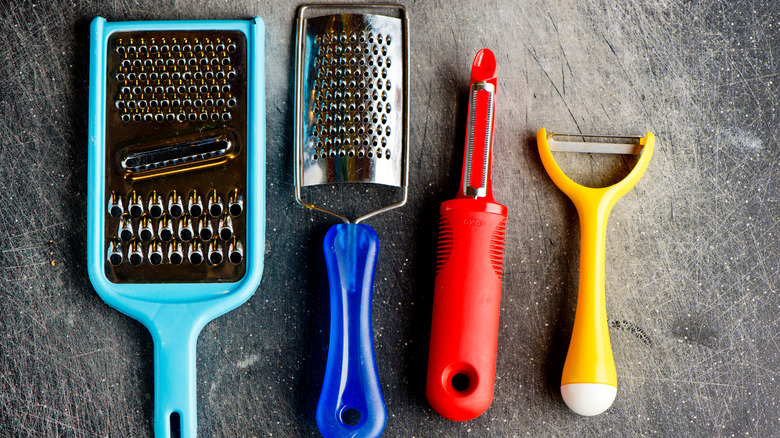 peelers and graters on counter
