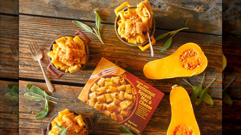 Small bowls of Trader Joe's butterbut squash mac and cheese, with halved butternut squashes