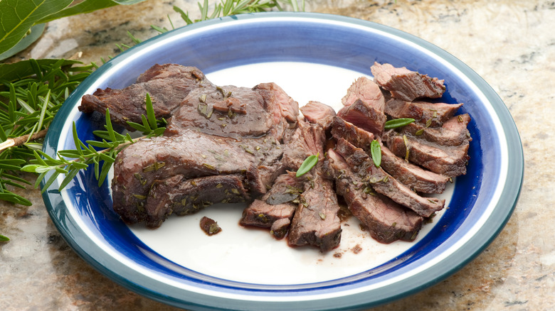 Cooked elk meat on plate