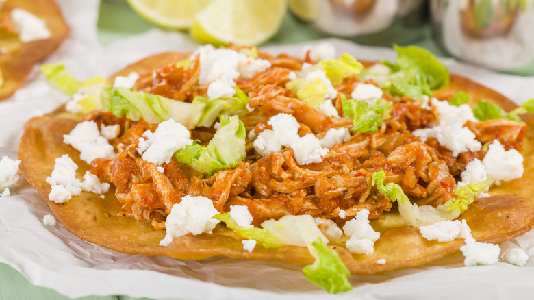 Chicken tinga on tostada