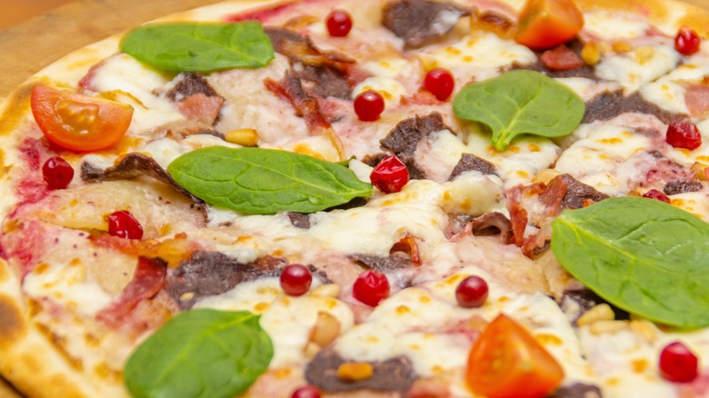 Pizza with venison and cranberies