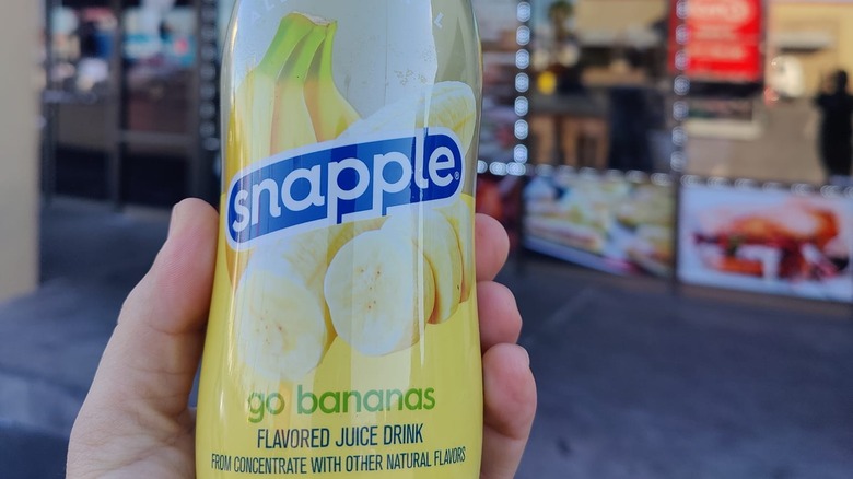 hand holding Snapple Go Bananas