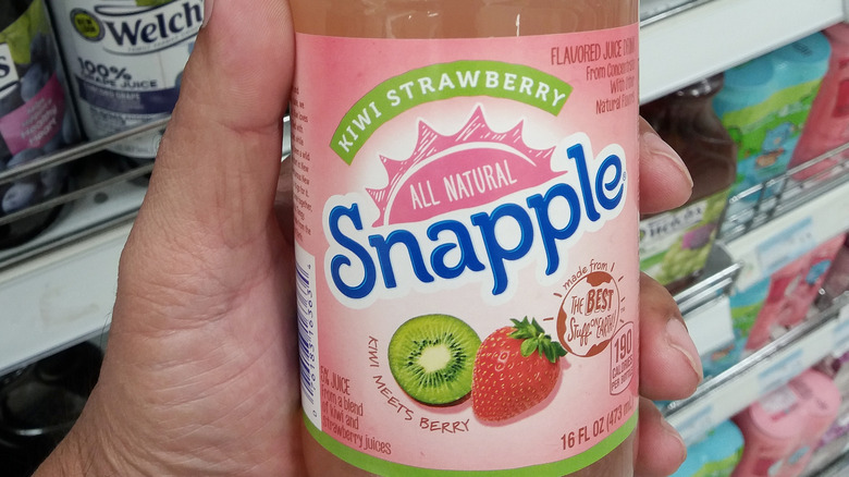 hand holding Snapple Kiwi Strawberry