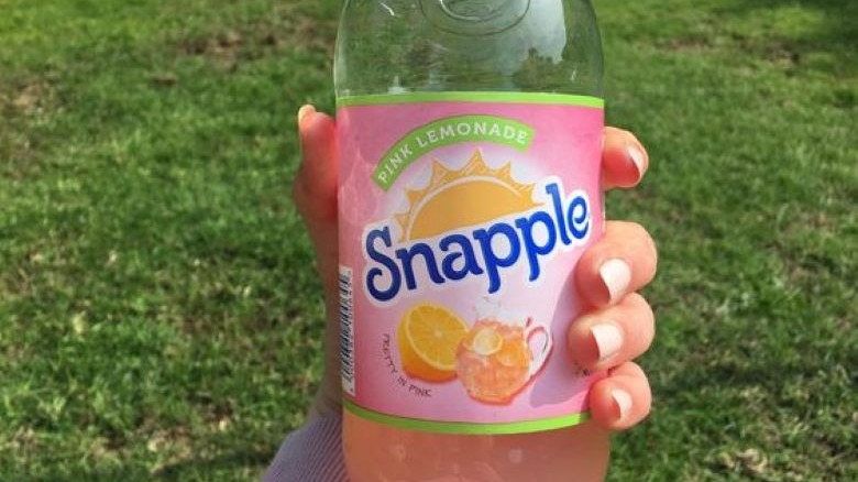 hand holding Snapple Pink Lemonade