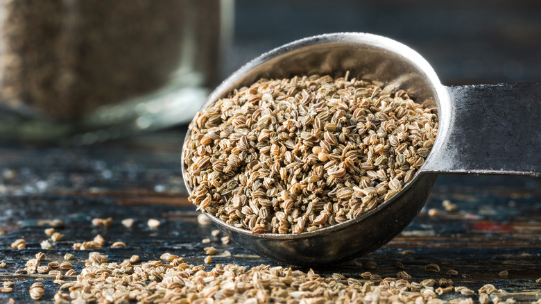 celery seeds spilling from teaspoon