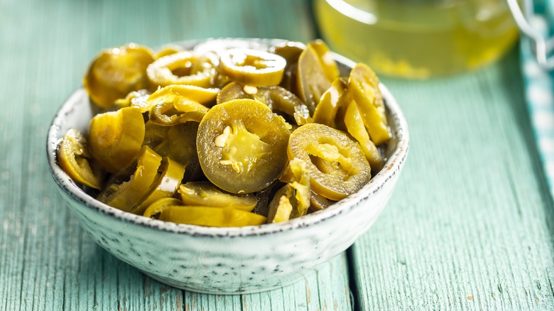 jalapeños in dish on table