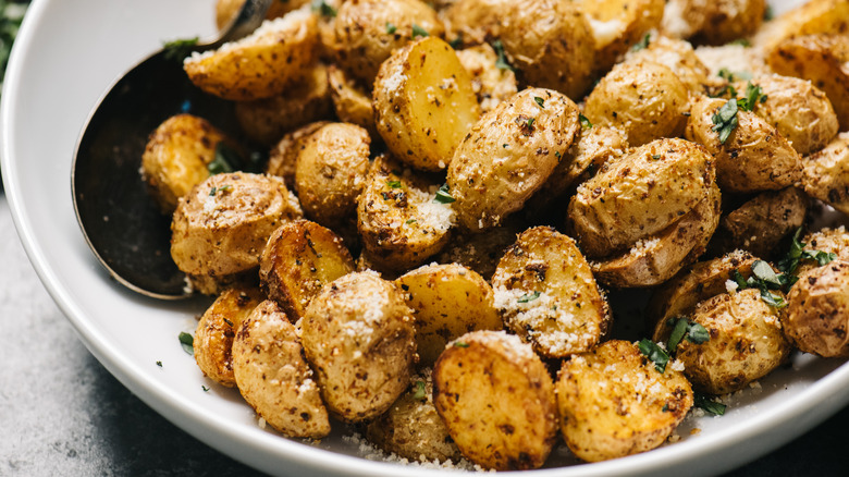 Crispy golden potatoes on plate