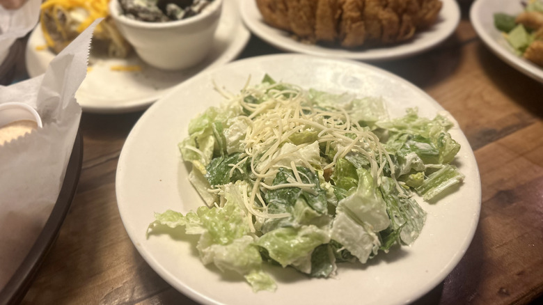A caesar salad topped with parmesan at Texas Roadhouse