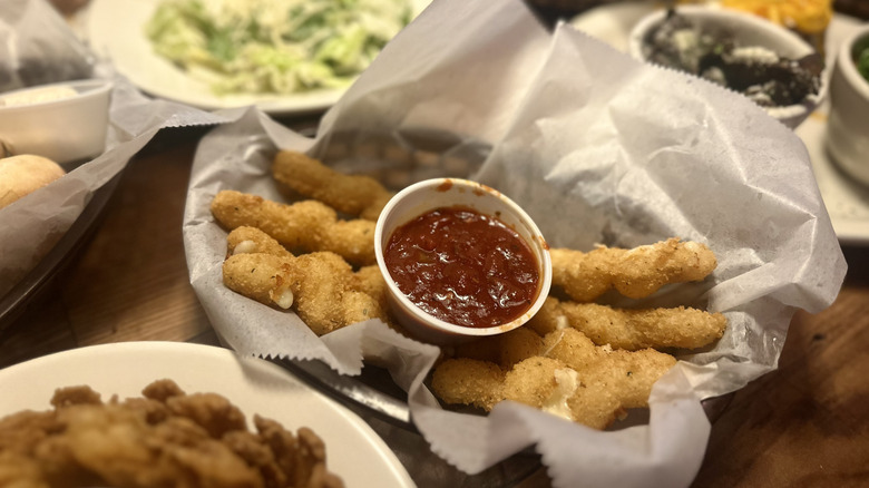 Twisted mozzarella sticks in a basket at Texas Roadhouse