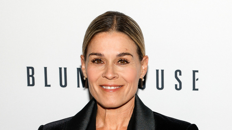 Cat Cora smiling in a promo photograph