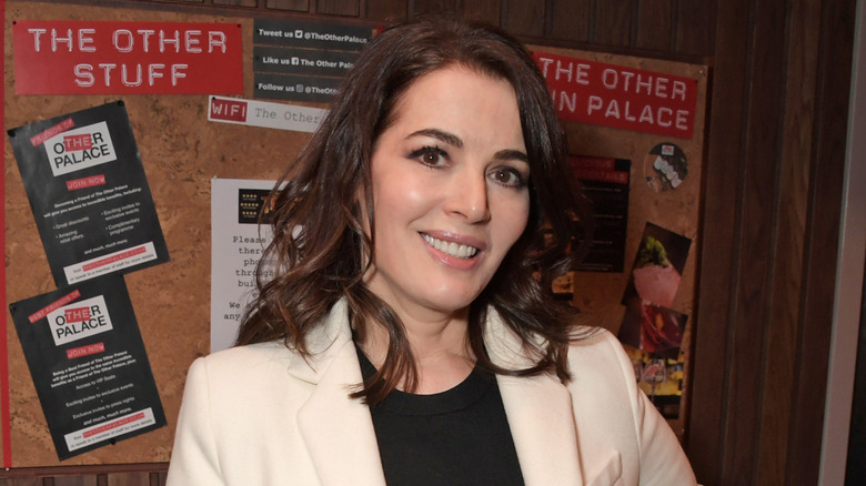 Nigella Lawson smiling in a promo photograph at The Other Palace theatre in London