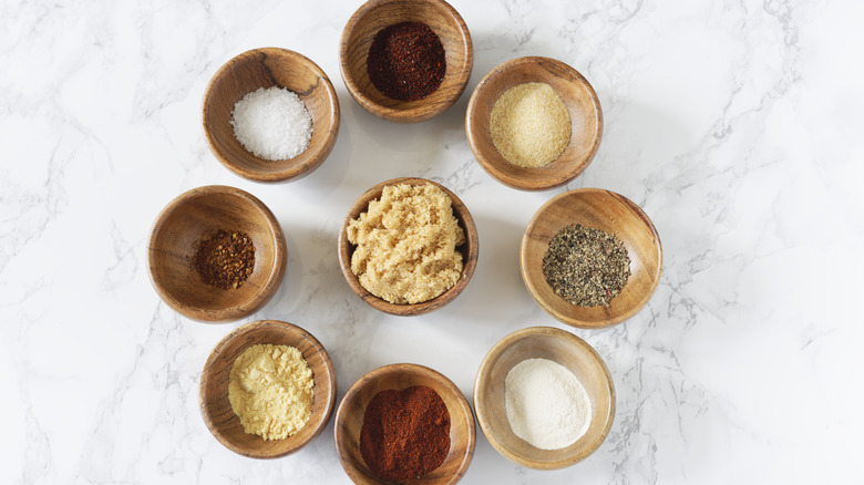 Selection of barbecue spices in small bowls