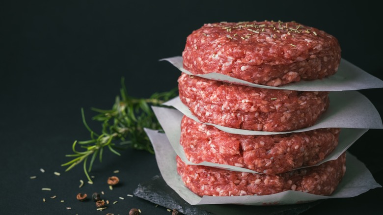 Stacked raw burger patties