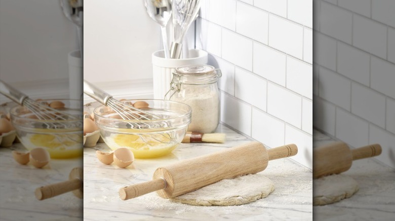 Wood rolling pin on white background