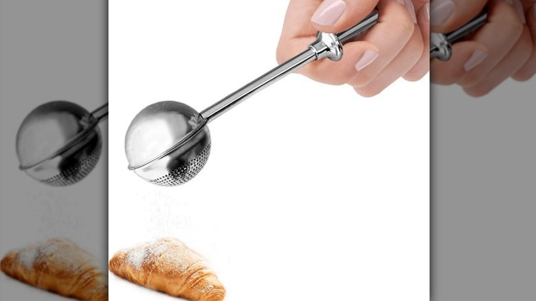 Powdered sugar shaker on white background