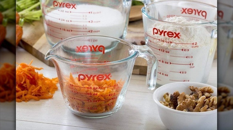 Pyrex measuring cups on white background