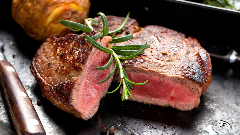 cuts of steak with veggies