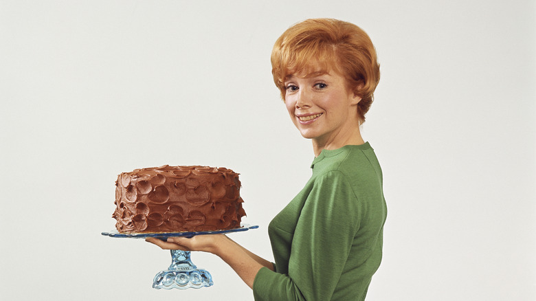 vintage woman holding cake