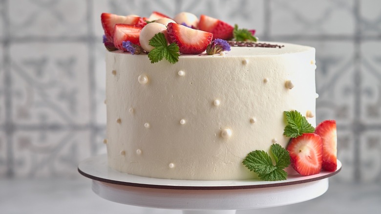 White frosted cake with strawberries